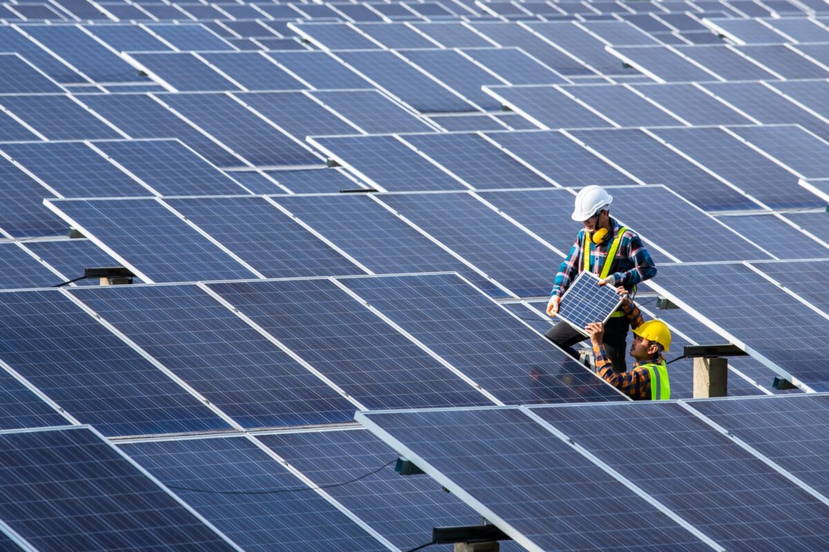An engineer seen checking on equipment in solar power plant An engineer seen checking on equipment in solar power plant