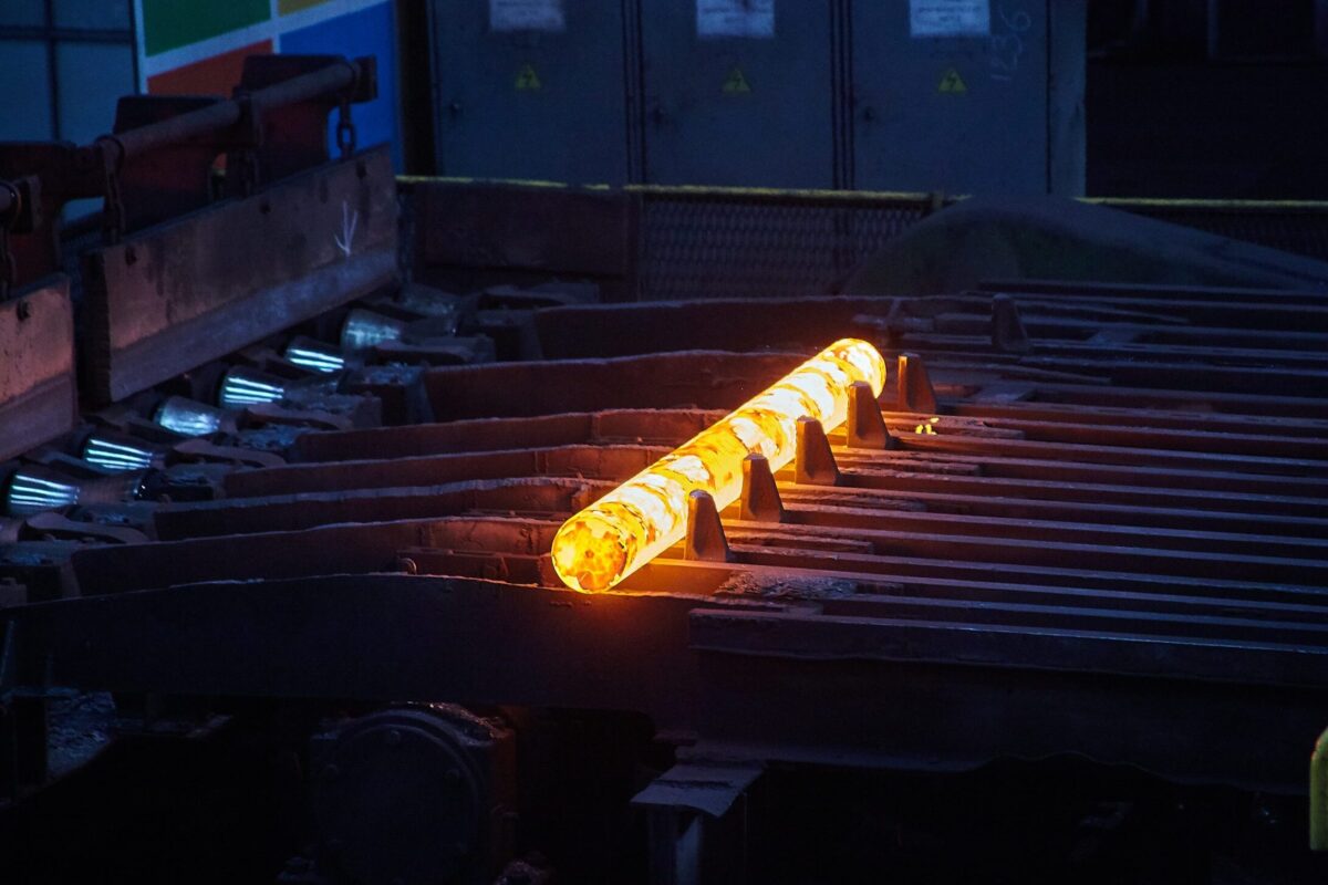 Hot Steel Rod A hot steel rod is seen at a Steel Works factory